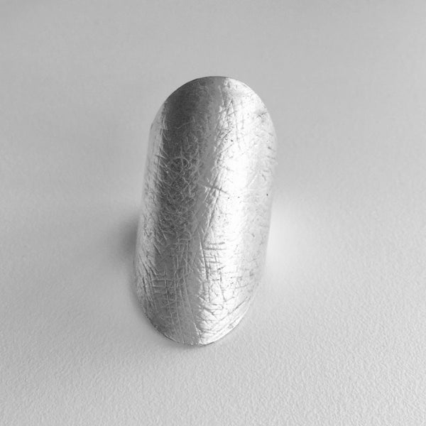 Sleek Silver Metal Large Turkish Modern Ring, with a smooth finish and lots of shine.  Make a statement ring your new signature piece, with this imported jewelry style made just for you. If you like Modern and Sleek Rings , this style is for you.  1.5 inches in height with a base ring size of 7.5