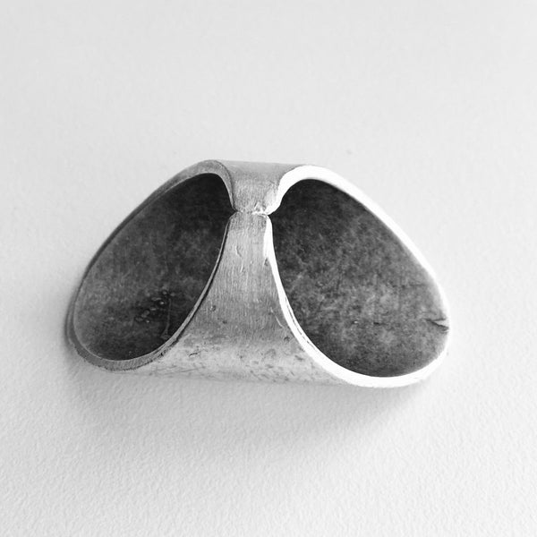 back side view of Sleek Silver Metal Large Turkish Modern Ring, with a smooth finish and lots of shine.  Make a statement ring your new signature piece, with this imported jewelry style made just for you. If you like Modern and Sleek Rings , this style is for you.  1.5 inches in height with a base ring size of 7.5