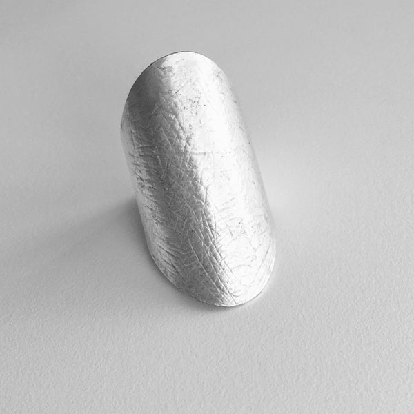 Sleek Silver Metal Large Turkish Modern Ring, with a smooth finish and lots of shine.  Make a statement ring your new signature piece, with this imported jewelry style made just for you. If you like Modern and Sleek Rings , this style is for you.  1.5 inches in height with a base ring size of 7.5