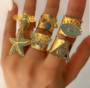 Bande de Vagabonds handmade brass adjustable rings with tuquoise stone inlayed adorned mascots to chose from: Starfish, Evil Eye, Pyramid of Wisdom, Butterfly, Beatle and Bumble Bee Beautiful medium sized eye catching statement rings